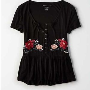 Black tee with buttons detailed with flowers